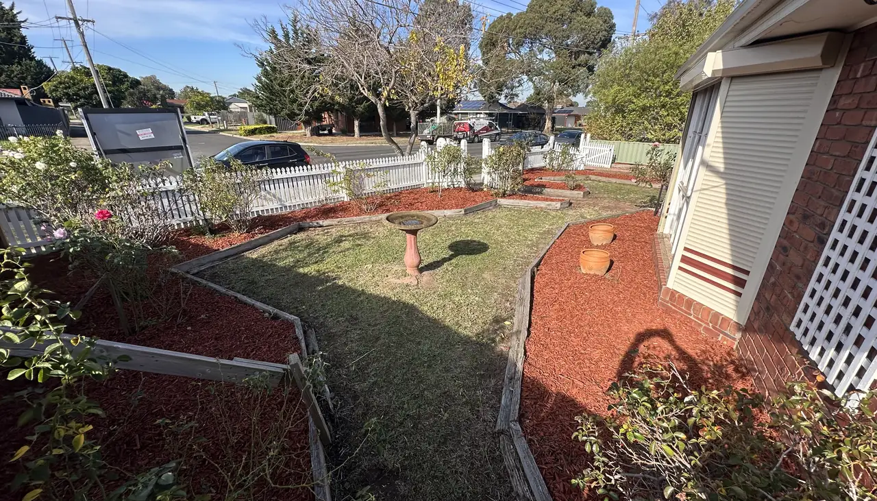 Front garden re-mulched and the lawn mown by C&J, the finish we leave behind