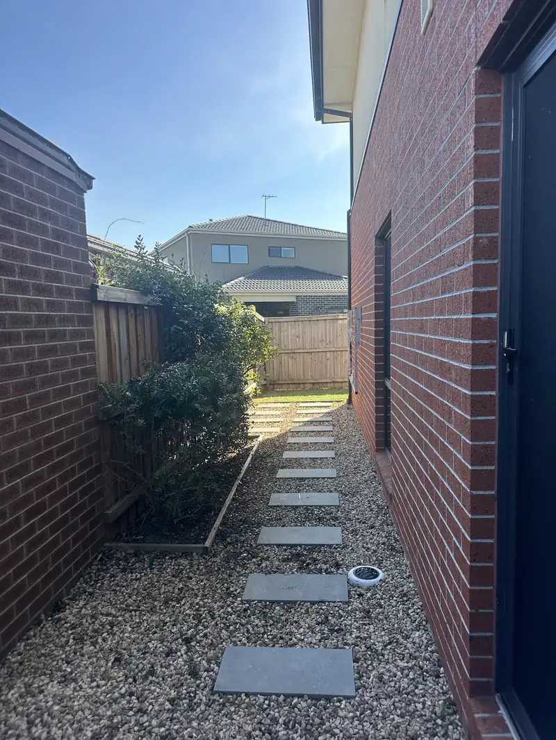 Brick side passage entry with planters, kept tidy by C&J